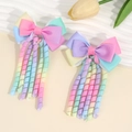 Rainbow gradient spiral bow hair clips for girls in a sweet macaron colored ribbon style - Dark Gradient
