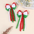 Pair of Christmas themed spiral bow hair clips in festive red, green, and white ribbons - Red Green White