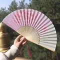 Classic Chinese folding fan featuring light purple cherry blossoms and pink silk tassel - Style 19