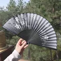 Classic folding silk fan with white lotus pattern, dark grey surface and tassel accent - Grey Tones Lotus & Dragonfly Style (No. 26)