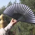 Classic black folding silk hand fan with silver patterns and a grey tassel charm - Black Base Silver Landscape Style (Smile Fan 27)