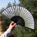 Classic Chinese green silk folding fan with bamboo frame and traditional plum blossom motifs - Green Toned Plum & Bamboo Style (Smile Fan 37)