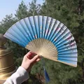 Chinese style blue silk folding fan with floral butterfly patterns and blue tassels - Blue Butterfly and Flower Style (Smile Fan 03)
