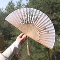 Classic bamboo folding fan with ink floral print and elegant pink silk tassel - Light-Colored Butterfly & Flower Design (Fan 81)
