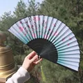 Classic folding fan with teal gradient silk, pink cherry blossoms and green tassel - Blue-Green Gradient Butterfly & Flower Motif (Smiling Fan 72)