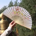 Classical Chinese silk folding fan with floral patterns and a golden silk tassel - Style 70