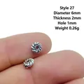 Tibetan silver spiral spacer bead for DIY jewelry, 6mm diameter held on a fingertip - 27# (Dia 6mm Thick 2mm)
