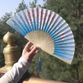 Blue and pink gradient folding fan with cherry blossoms, bamboo ribs, and light blue tassel - Blue-Pink Gradient Cherry Blossom Style (Smile Fan 63)