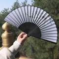 Classic Chinese folding fan with blue floral pattern, black bamboo frame and tassel - Gray-Toned Orchid Style (Smile Fan 60)