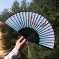 Ancient style folding fan with blue silk gradient, red plum blossoms and green tassel - Light Blue Gradient Butterfly & Plum Blossom Style (Fan 49)