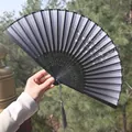 Classic Chinese folding fan in black with elegant ink flower print and long tassel - Black Ink Floral Style (One Smile Fan 47)