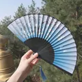 Sky blue Chinese folding fan with white plum blossoms and a matching blue silk tassel - Sky Blue Floral Style (Fan 43)