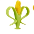 Baby silicone teether toothbrush in corn shape with yellow grip and suction base - Corn Style