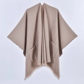 Detailed view of women's knitted shawl featuring large side pockets and fringed edges - Pocket Style Khaki