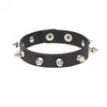 Detailed view of punk black PU leather cuff with silver metal spikes and snap closures - Conical Spiked Studded Style / Black