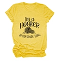 Detail of yellow cotton T-shirt featuring I'M A HOOKER crochet graphic and slogan - Yellow (Black Font)