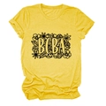 Detail showing BCBA floral print on a mustard yellow crew neck short sleeve cotton T-shirt - Yellow (Black Text)