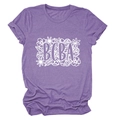 Close-up of BCBA floral print on a heather purple crew neck casual t-shirt for women - Purple (White Text)