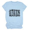 Detail of BCBA floral print on light blue cotton t-shirt with minimalist crew neck design - Light Blue (Black Text)