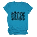 Detail of bright blue round neck t-shirt featuring BCBA lettering and floral print - Lake Blue (Black Text)