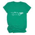 Close-up of Every Little Thing text and bird print on green cotton t-shirt fabric - Ink Green (White Text)