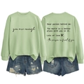 Detail of mint green sweatshirt with healing text and ripped denim shorts set - S / Olive Green (Black Font)