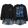 Close-up of In My Boy Mom Era letter print on black sweatshirt and distressed denim shorts - Black
