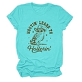 Detail of turquoise t-shirt featuring a retro cowboy owl print and HOOTIN LEADS TO text - Deep Water Blue