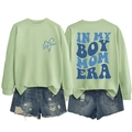 Detail of Boy Mom Era sweatshirt with back print and distressed denim shorts - Olive Green