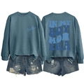 Detail view showing printed Boy Mom Era graphics on crewneck sweatshirt and denim shorts - Blue