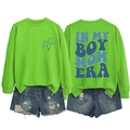Flat lay of Boy Mom sweatshirt with back graphic and ripped denim shorts set - Fluorescent Green