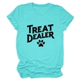 Detail of teal cotton T-shirt featuring TREAT DEALER text and black paw print graphic - S / Tops / Deep Water Blue (Black Paw Print)