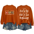 Front and back view of orange long sleeve sweatshirt with Hospice Nurse print and quote - Burnt Orange (White Print)