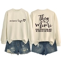 Front and back detail of Mimi Life oversized sweatshirt with ripped denim shorts - Sand (Black Font)