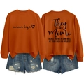 Front and back view of orange Mimi sweatshirt with vintage print and denim shorts - Burnt Orange (Black Font)