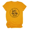Detail of Girl's Trip 2025 slogan and rolled sleeves on ginger yellow cotton t-shirt - S / Mustard Yellow (Black Font)