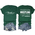 Detail view of Wrestling Mom T-shirt featuring heart print on dark green cotton fabric - Vintage Green (White Font)