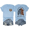 Front and back detail of light blue tee with floral skull and ribcage artistic prints - S / Light Blue Front Chest (Black Graphic)