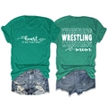 Detail of green Wrestling Mom t-shirt with back slogan print and casual denim shorts - Dark Green (White Font)