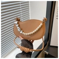 Detailed view of brown faux leather crescent bag with pearl heart chain and knot strap - Khaki