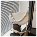 Detail of white saddle bag with heart pearl chain and knot shoulder strap - White