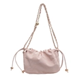 Chic pink drawstring bucket bag with gold chain strap and cloud-inspired pleats - Pink