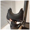 Detail of black crescent shoulder bag with silver chain strap and matte leather texture - Black