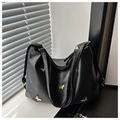 Detailed view of black PU leather tote with golden butterfly charms and top zipper - Black