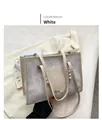 White fashion tote bag with floral embossing and decorative pearl chain strap - White