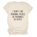 Detail of rolled sleeves and printed text on cream loose fit cotton t-shirt - Sand (Black Font)
