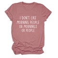 Close-up of I Don't Like Morning People slogan print on pink cotton T-shirt fabric - Rose Gold (White Font)