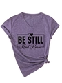 Detail of purple V-neck T-shirt with side knot and BE STILL And Know slogan print - Purple (Black Font)