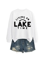 Detail of white sweatshirt with Living on Lake Time print and distressed denim shorts - White Sweatshirt (Black Font)
