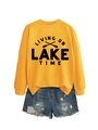 Detail of Living on Lake Time graphic print on yellow crewneck sweatshirt fabric - Yellow Sweatshirt (Black Font)